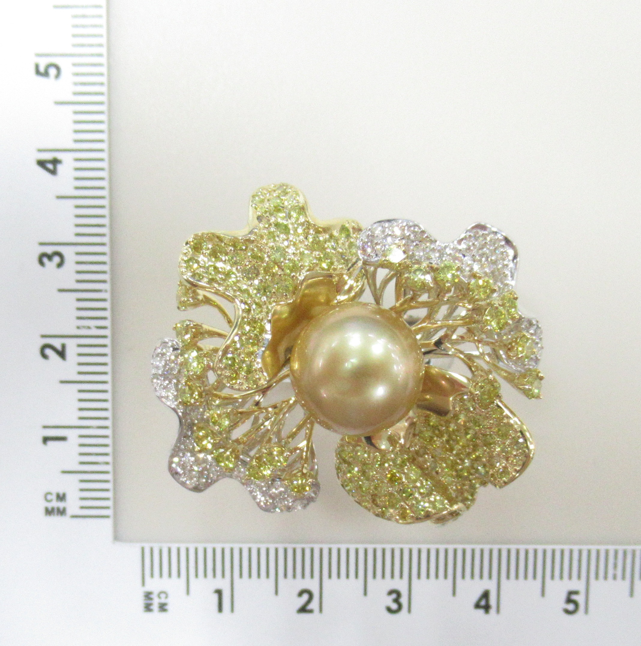 Золотое кольцо 585 пробы; белое,желтое золото; родий; вставки 1 Жемчуг культ. морск. золотой 11,569;